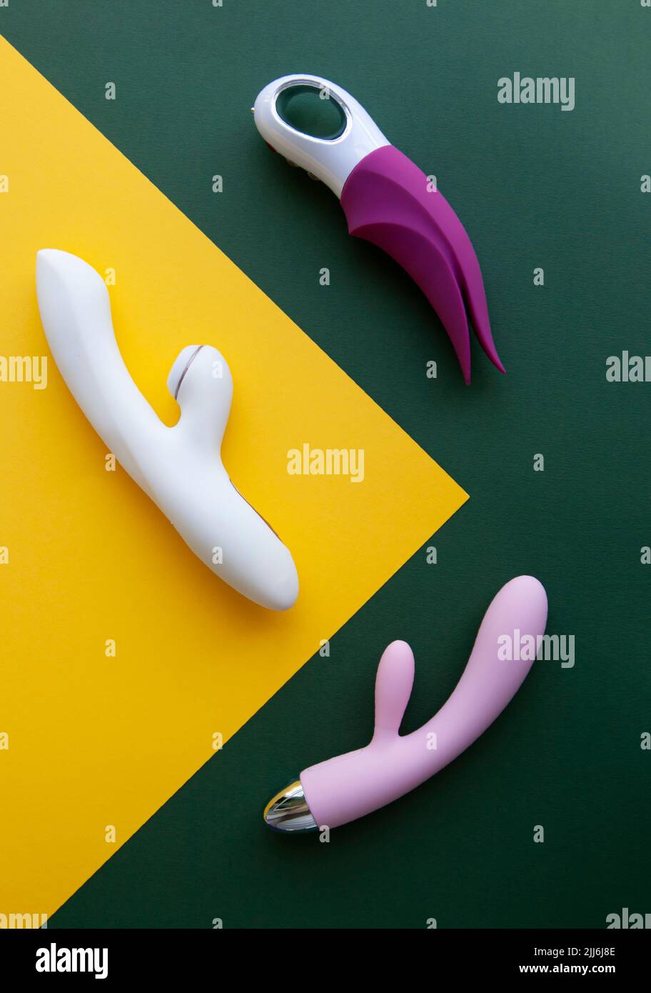 Collection of different types of sex toys on a green and yellow background  Stock Photo - Alamy