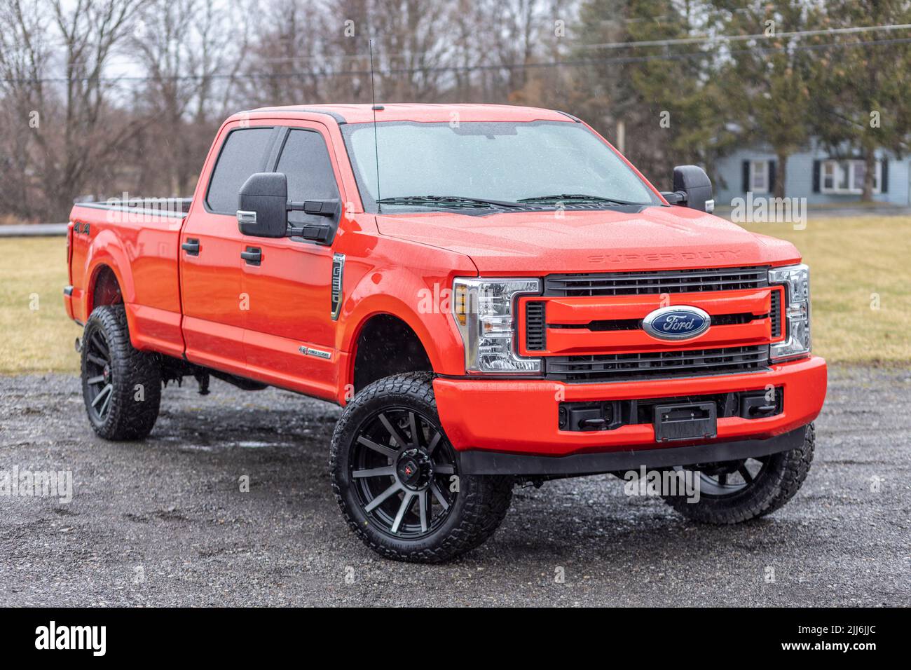 A red lifted Ford truck with aftermarket wheels in Oswego, New York, United States Stock Photo