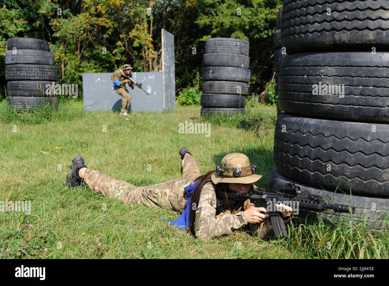 Ukrainian civilians using laser tag weapons take part in tactical