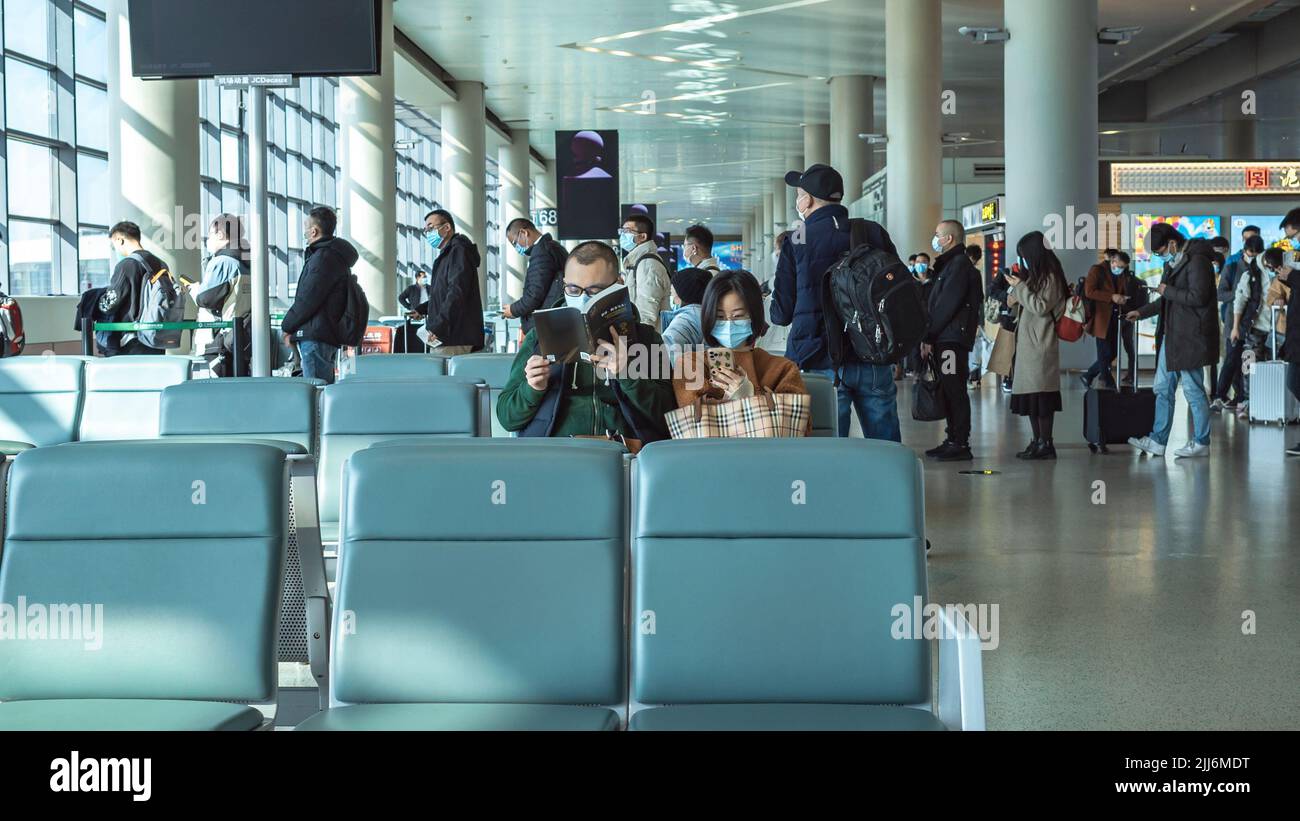 Waiting airport reading hi-res stock photography and images - Alamy