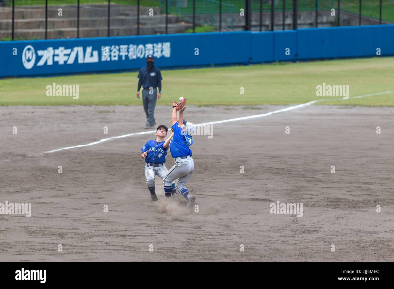 The highangle of pitcher catching baseball children playing sport