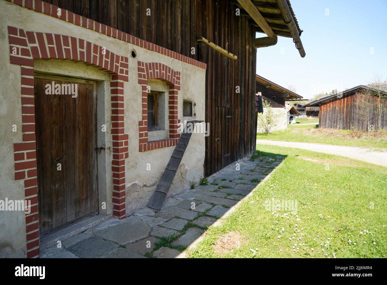 A view of an old house with wooden door and window in a village Stock ...