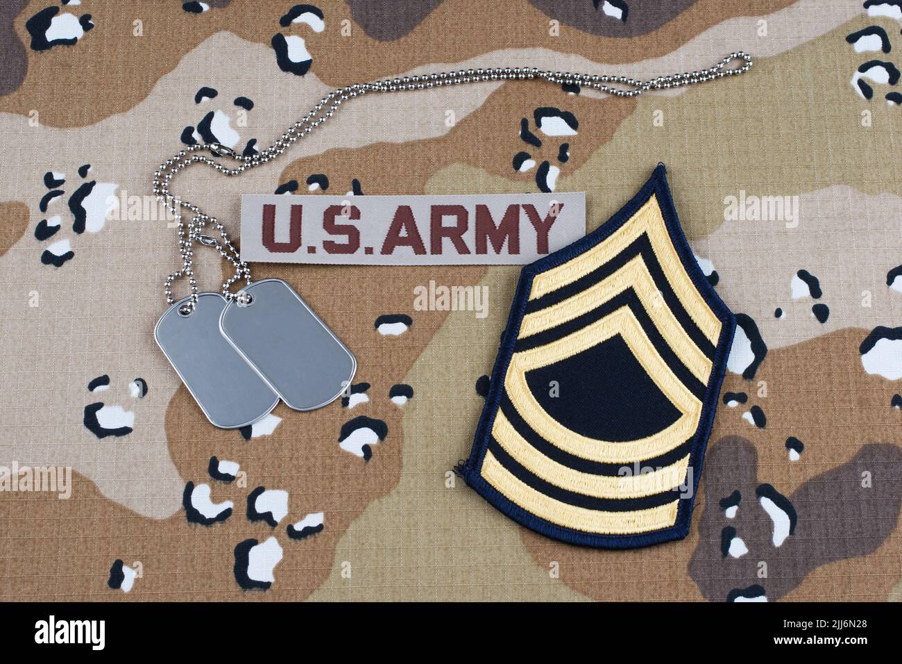May 12, 2018. US ARMY Master Sergeant rank patch and dog tags on Desert Battle Dress Uniform Stock Photo