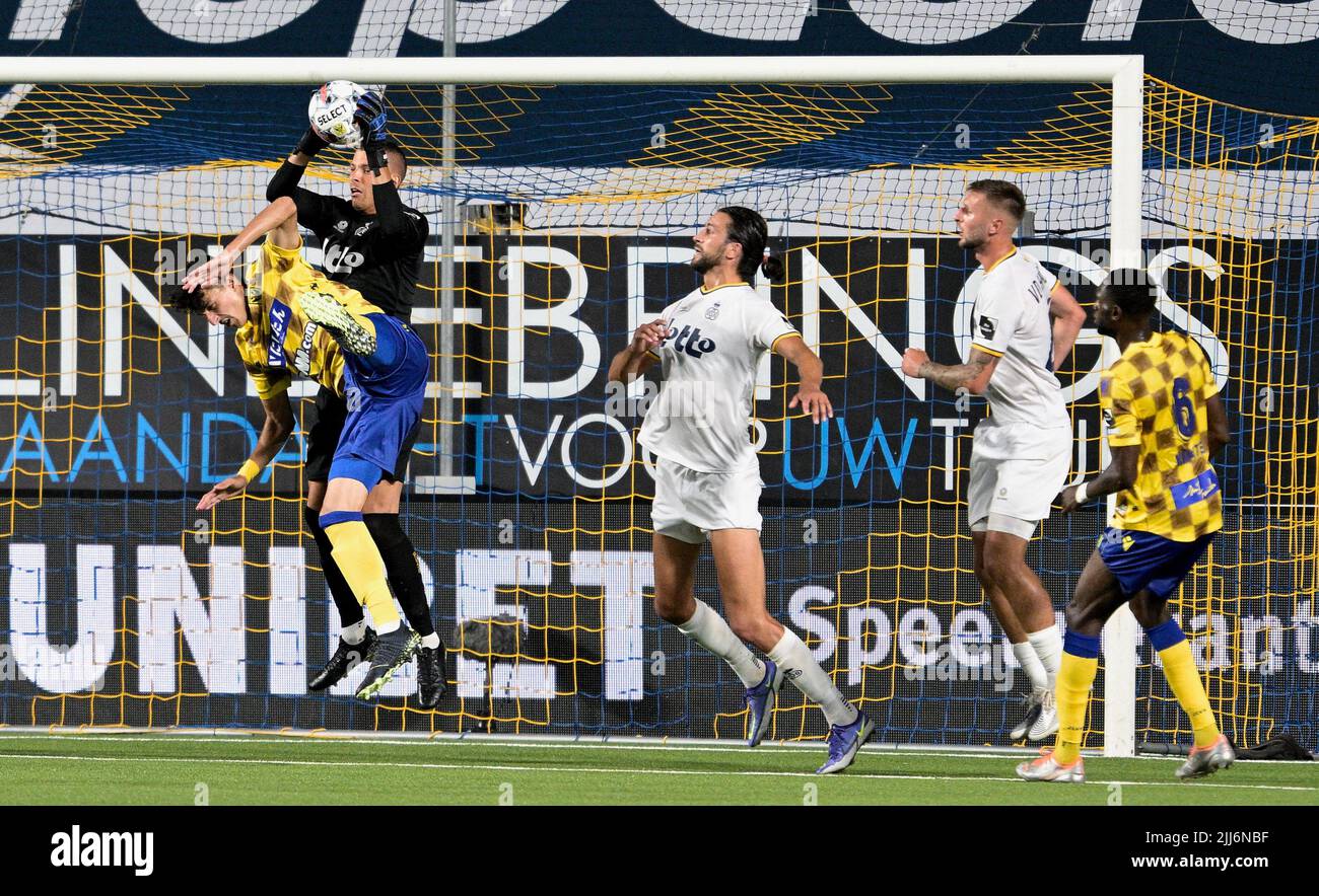 STVV's Ameen Al-Dakhil and Union's goalkeeper Anthony Moris fight for the ball during a soccer match between Sint-Truidense VV and Royale Union Saint-Gilloise, Saturday 23 July 2022 in Sint-Truiden, on day 1 of the 2022-2023 'Jupiler Pro League' first division of the Belgian championship. BELGA PHOTO JOHAN EYCKENS Stock Photo