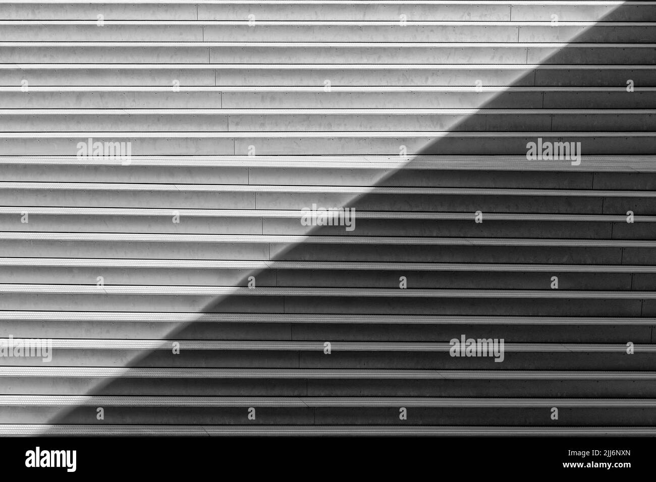 A grayscale shot of the exterior staircase of MS Maritime Museum in Helsingor, Denmark Stock Photo