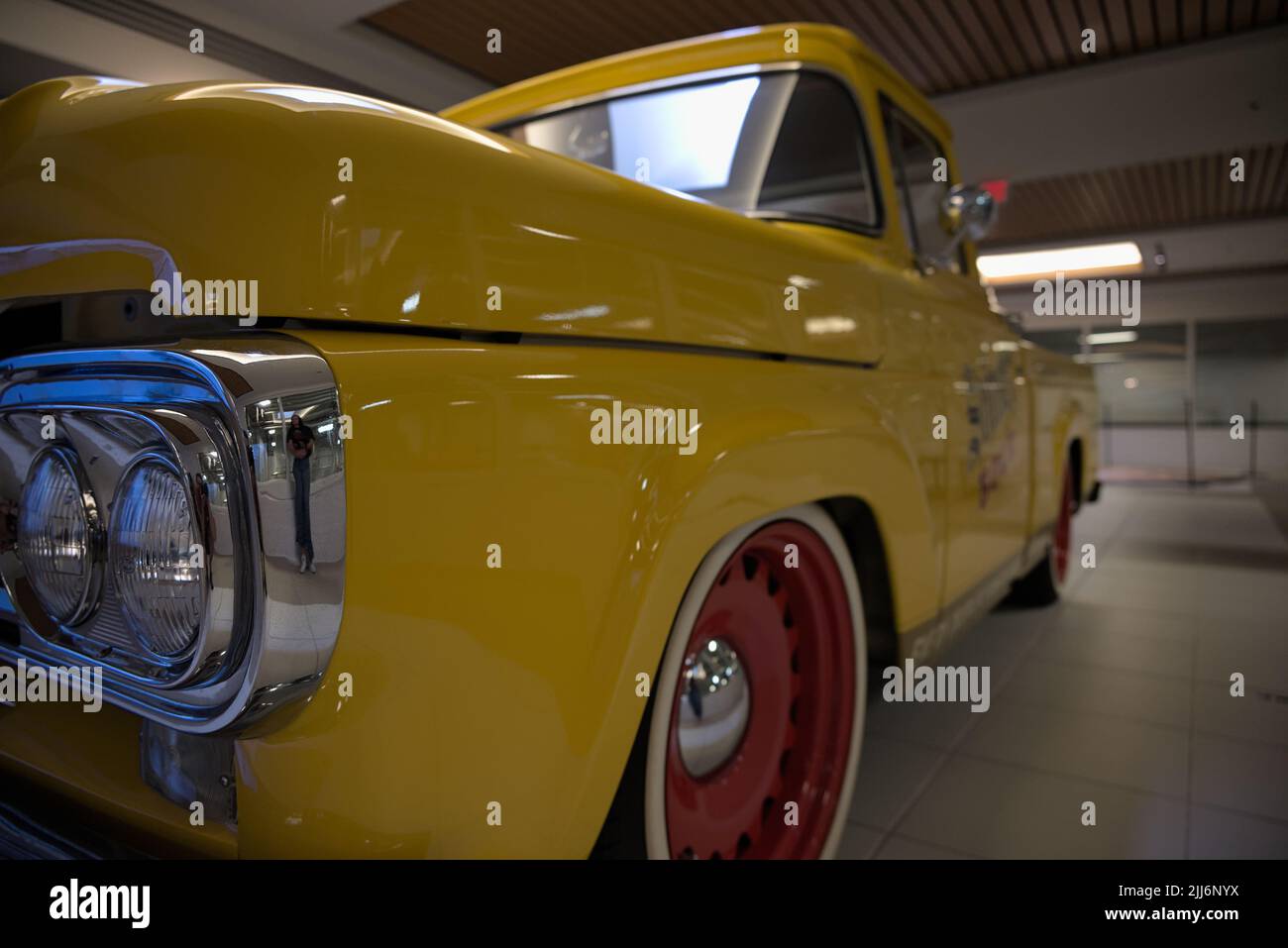 A closeup shot of a Yellow Ford truck with Shiner Bock logo on door at the Spoetzl Brewery Stock Photo