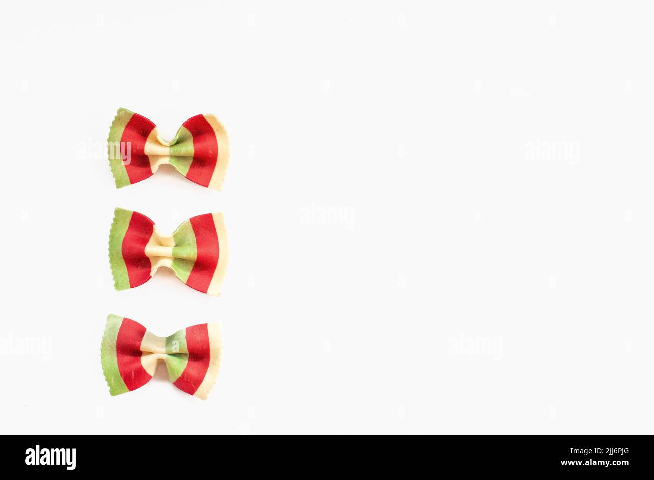 A set of colorful bow-tie pasta isolated on white background Stock