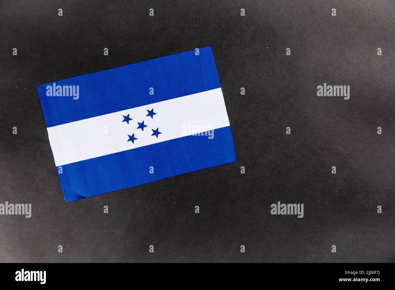A close-up shot of the flag of Honduras on a dark background with copy space Stock Photo