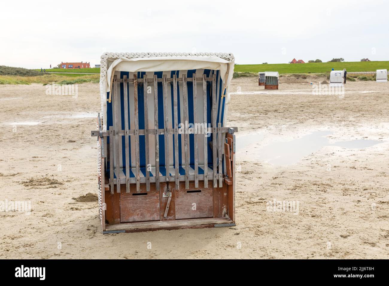 An old beach chair on the North Sea beach in Germany Stock Photo Alamy
