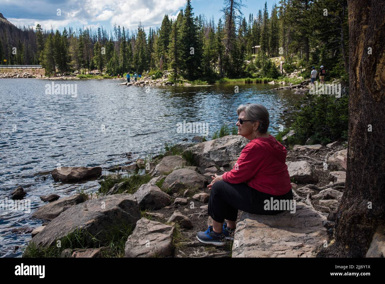 Woman gazing at mountains hi-res stock photography and images - Alamy