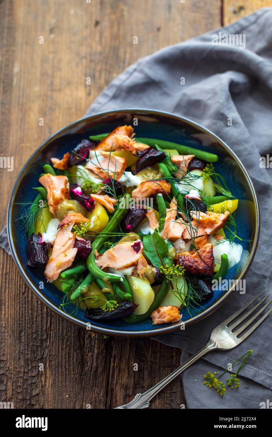 Potato, roast beetroots, green beans and salmon salad Stock Photo