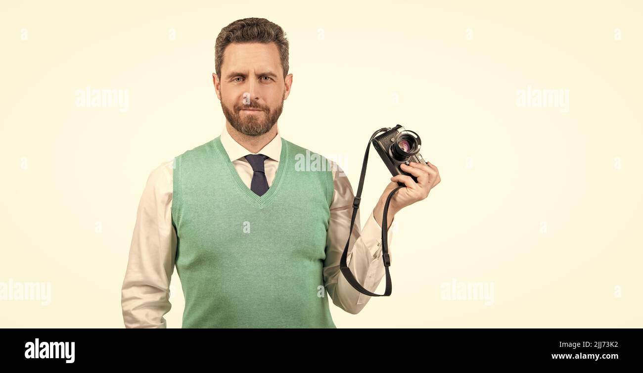 man photographing. guy hold photo camera. amateur and professional photography. Stock Photo