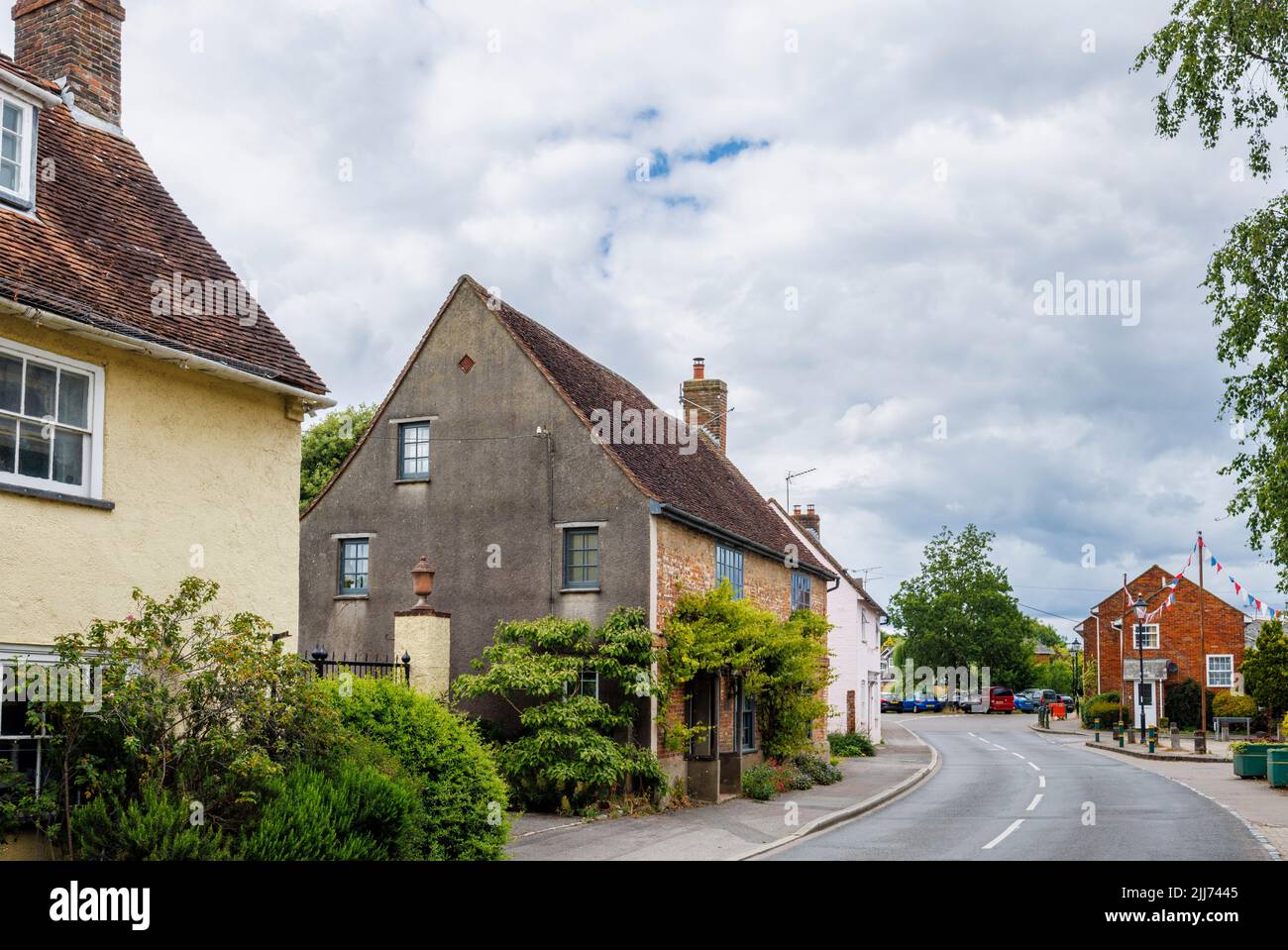 Street scene in Fordingbridge, a small village in the New Forest, Hampshire: roadside cottages without front gardens opening direct on to the street Stock Photo