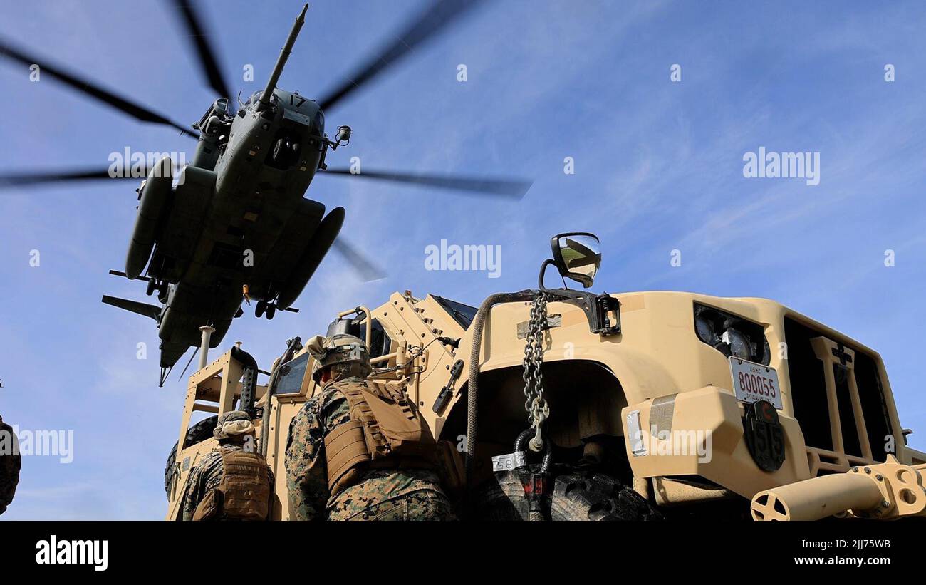 U.S. Marines with 3d Battalion, 12th Marines conduct an airlift of a Joint Light Tactical Vehicle at a helicopter external lift drill on Camp Hansen, Okinawa, Japan, July 18, 2022. 3/12 regularly conducts airlift training to improve rapid insertion and extraction of equipment, producing lethal, ready, and adaptable forces capable of operations across a wide range of missions. (U.S. Marine Corps photo by Cpl. Alyssa Chuluda) Stock Photo