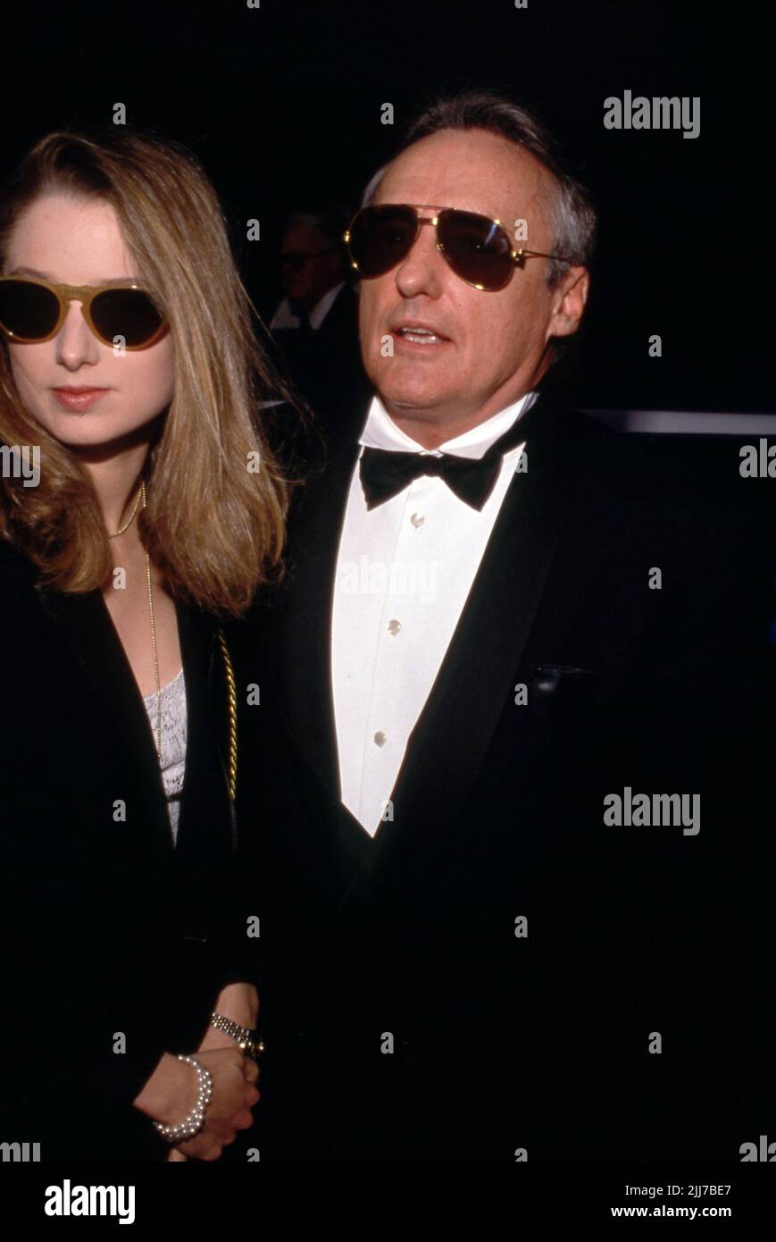 Dennis Hopper and Katherine LaNasa Circa 1990's  Credit: Ralph Dominguez/MediaPunch Stock Photo