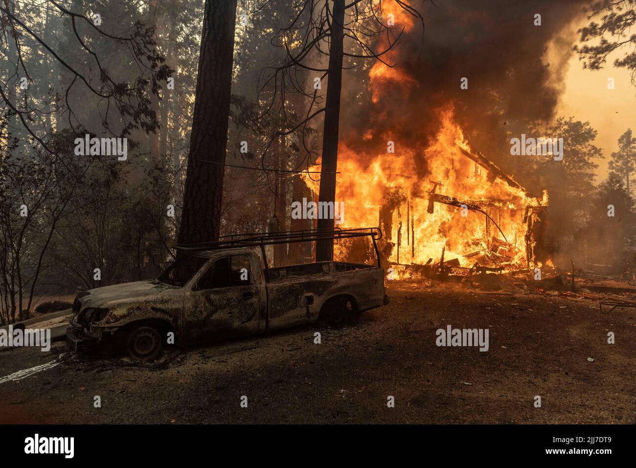 A house is seen on fire as the Oak Fire burns near Darrah in Mariposa County, California, U.S. July 23, 2022. REUTERS/Carlos Barria     TPX IMAGES OF THE DAY Stock Photo