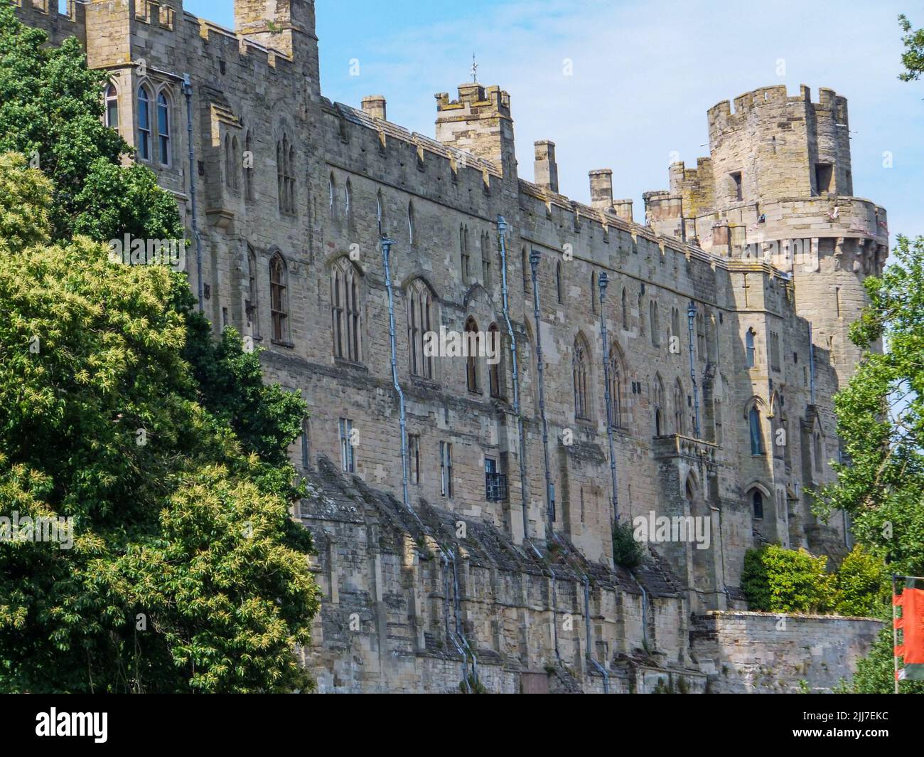 The imposing exterior walls of the medieval Warwick Castle in ...