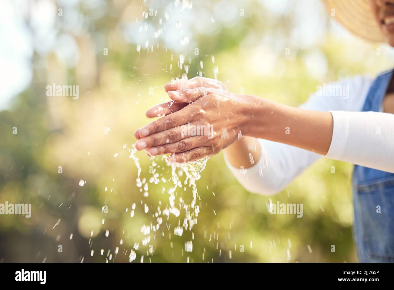 Keep it clean and stay healthy. an unrecognizable woman washing her hands outside. Stock Photo