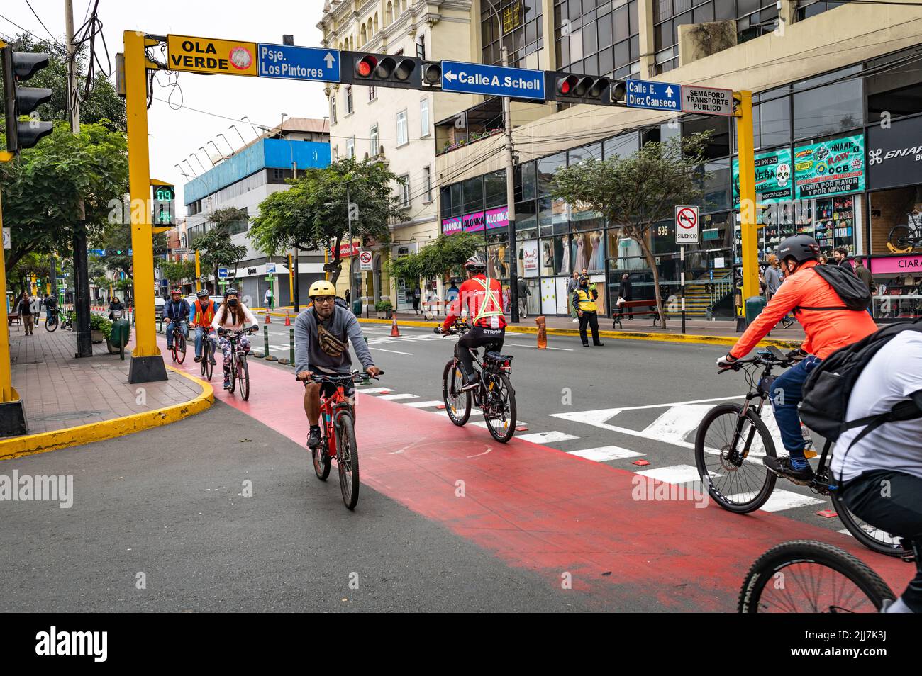 Bikers riding on Av. Jose Larco in Miraflores.  Bike lanes are located throughout the busy city for transportation Stock Photo