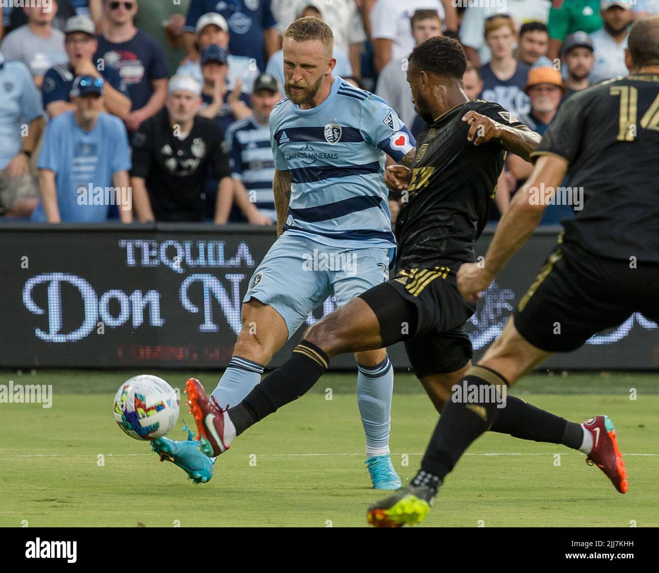 Kansas City, Kansas, USA. 23rd July, 2022. LAFC midfielder Kellyn Acosta #23 (r) impedes the offense of Sporting KC forward Johnny Russell #7 (l) during the first half of the game. (Credit Image: © Serena S.Y. Hsu/ZUMA Press Wire) Stock Photo