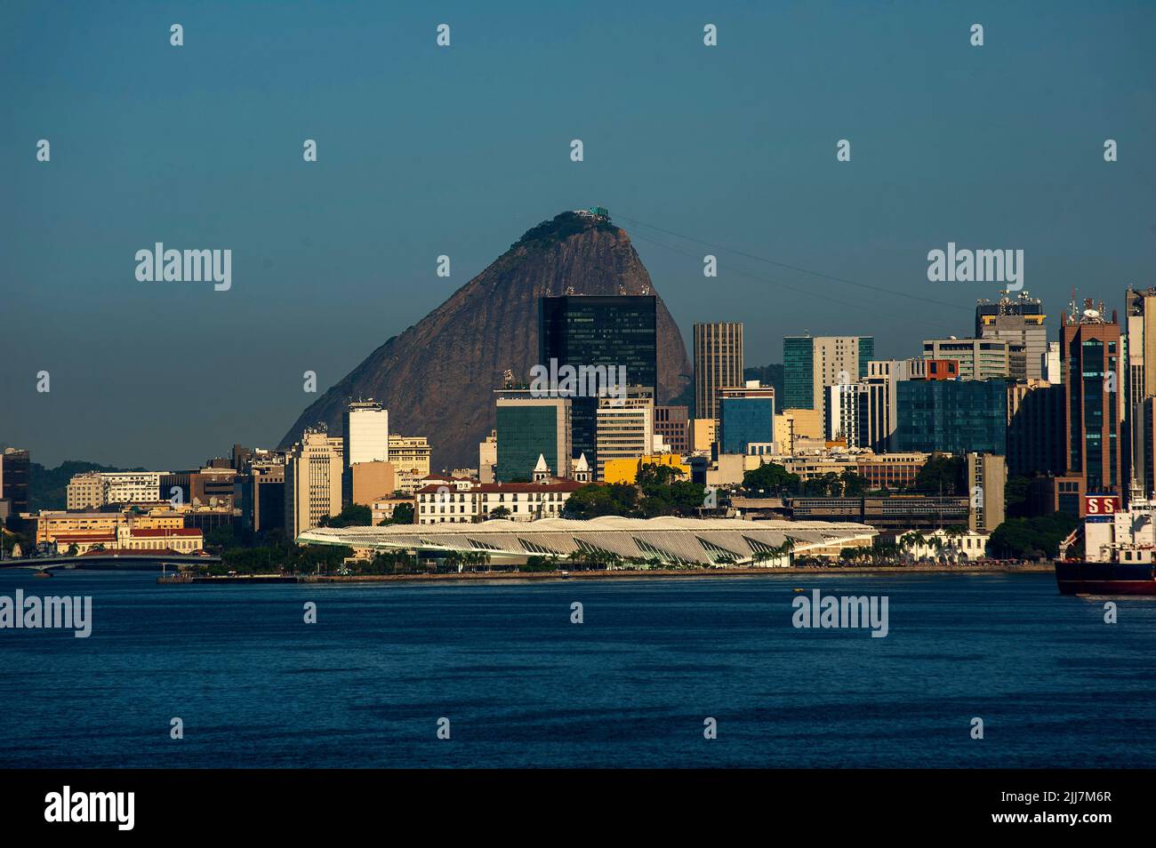 Buildings in the city center of Rio de Janeiro, with the popular Sugarloaf in the background and Tomorrow Museum in the foreground, Brazil Stock Photo