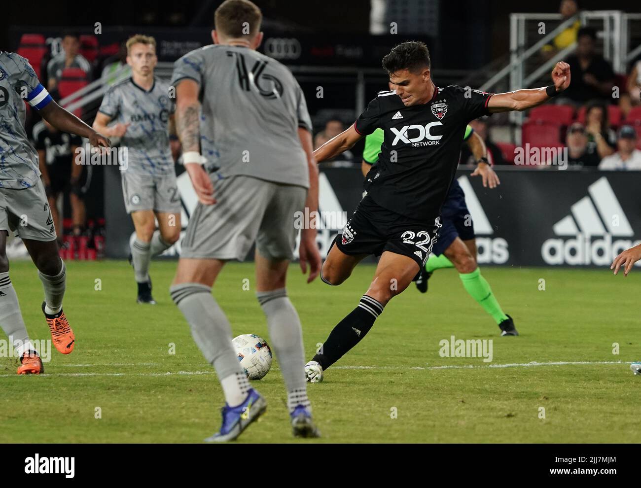 WASHINGTON, DC, USA - 23 JULY 2022: D.C. United forward Miguel Berry(22) shoots past CF Montréal defender Joel Waterman (16)during a MLS match between D.C United and C.F. Montreal, on July 23, 2022, at Audi Field, in Washington, DC. (Photo by Tony Quinn-Alamy Live News) Stock Photo