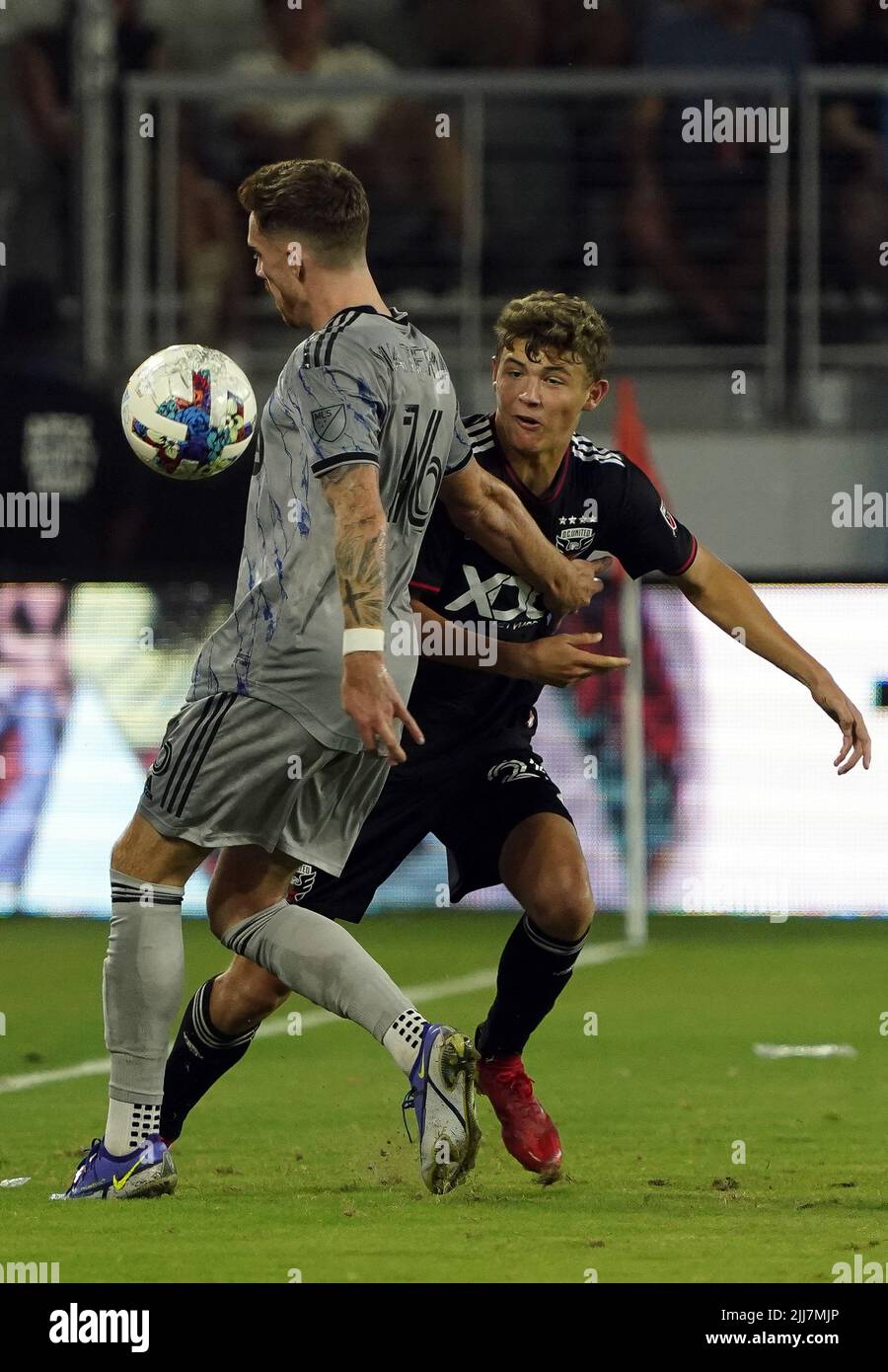 WASHINGTON, DC, USA - 23 JULY 2022: CF Montréal defender Joel Waterman (16) chests the ball away from D.C. United midfielder Theodore Ku-DiPietro (35)during a MLS match between D.C United and C.F. Montreal, on July 23, 2022, at Audi Field, in Washington, DC. (Photo by Tony Quinn-Alamy Live News) Stock Photo
