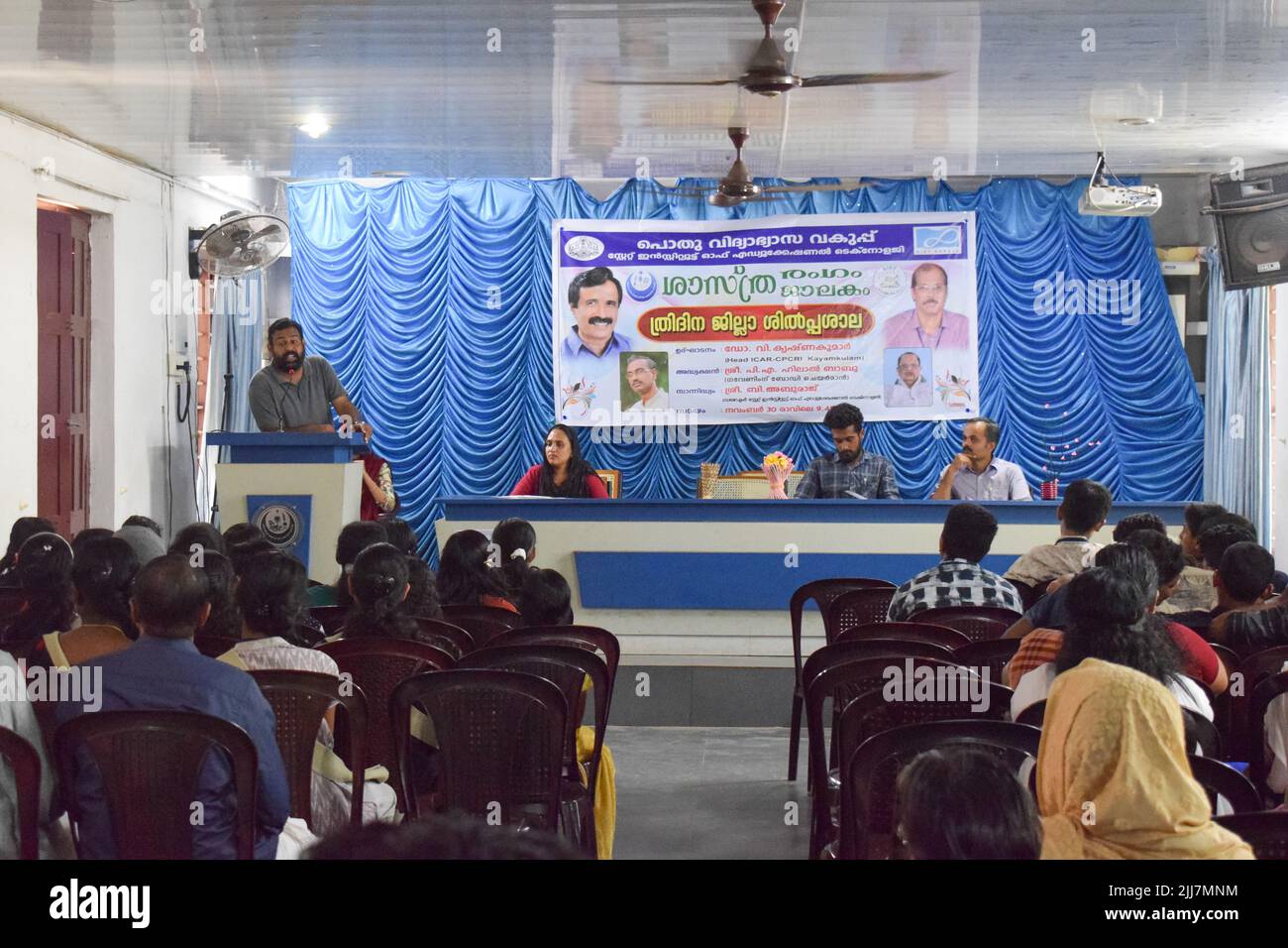 A teacher is speaking in the inauguration of a function in school. Stock Photo