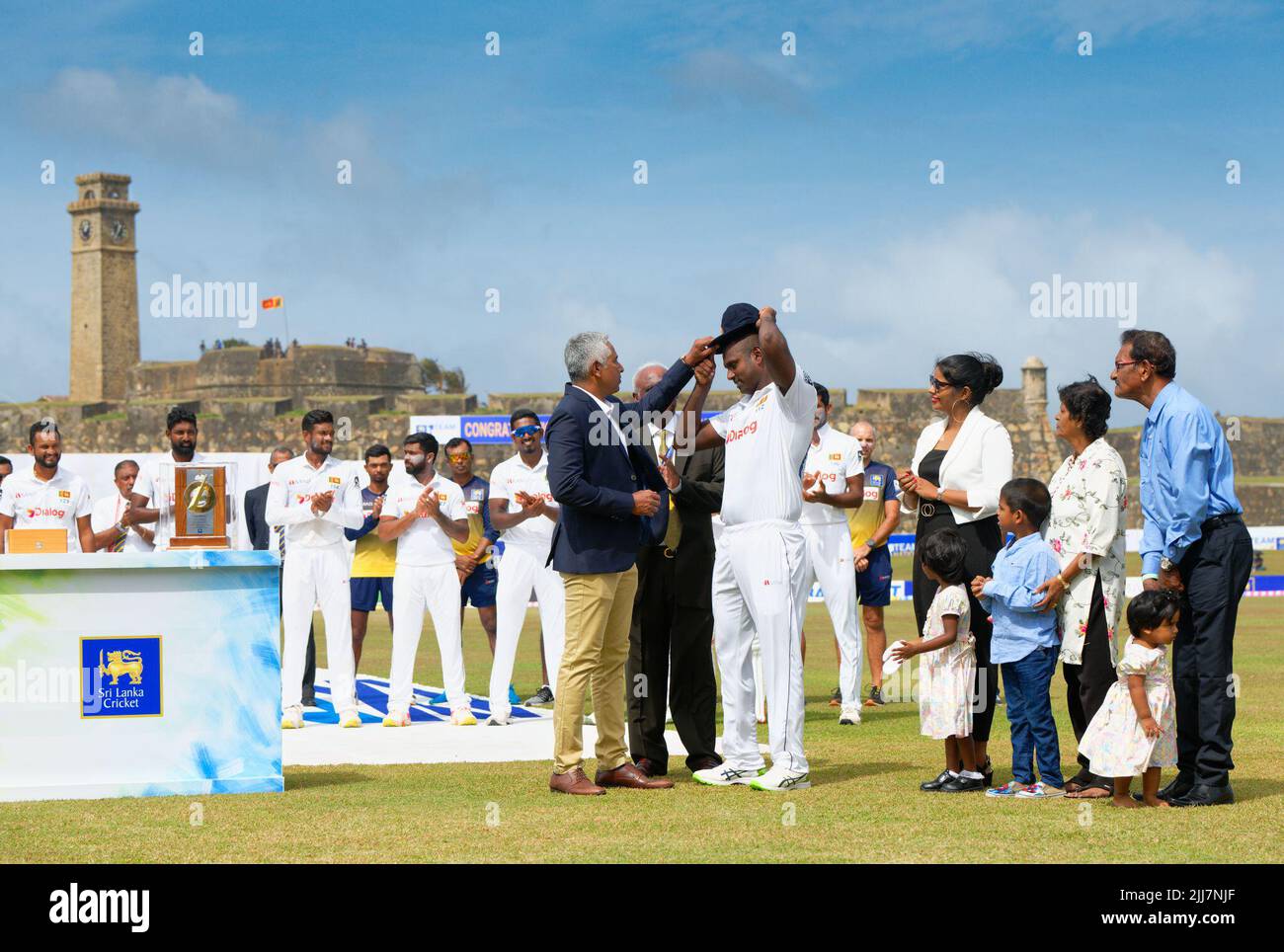 Galle, Sri Lanka. 24th July, 2022. Sri Lanka's Angelo Mathews receives his 100th cap from former Sri Lankan cricketer Chaminda Vaas (L) during the 1st day of the 2nd test cricket match between Sri Lanka vs Pakistan at the Galle International Cricket Stadium in Galle on 24th July, 2022. Viraj Kothalwala/Alamy Live News Stock Photo