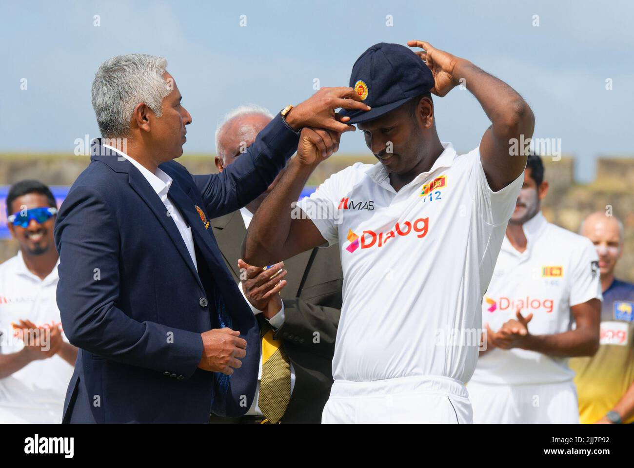 Galle, Sri Lanka. 24th July, 2022. Sri Lanka's Angelo Mathews receives his 100th cap from former Sri Lankan cricketer Chaminda Vaas (L)during the 1st day of the 2nd test cricket match between Sri Lanka vs Pakistan at the Galle International Cricket Stadium in Galle on 24th July, 2022. Viraj Kothalwala/Alamy Live News Stock Photo