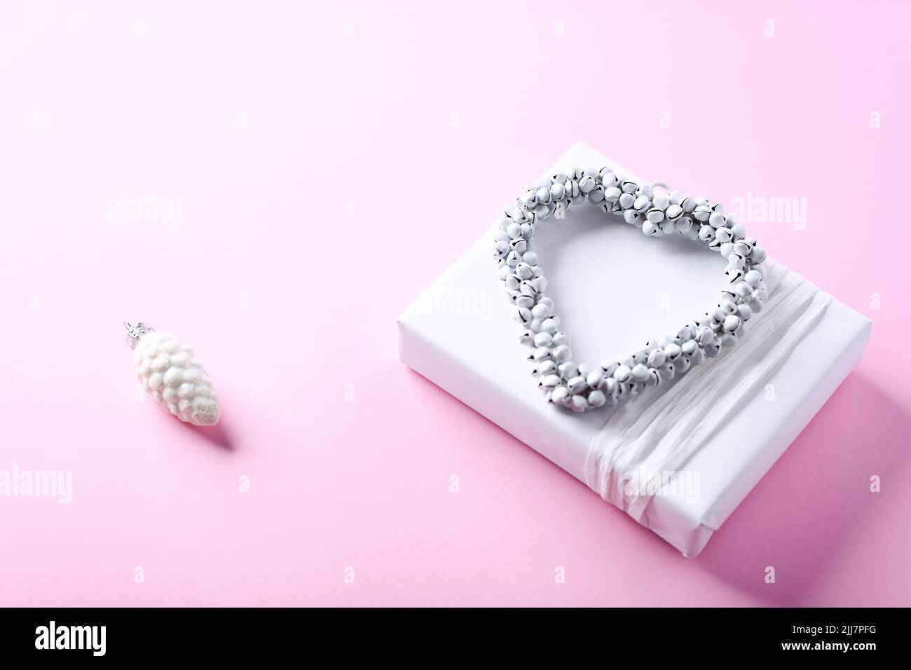 Christmas present on bright paper background. Close up. Copy space ...