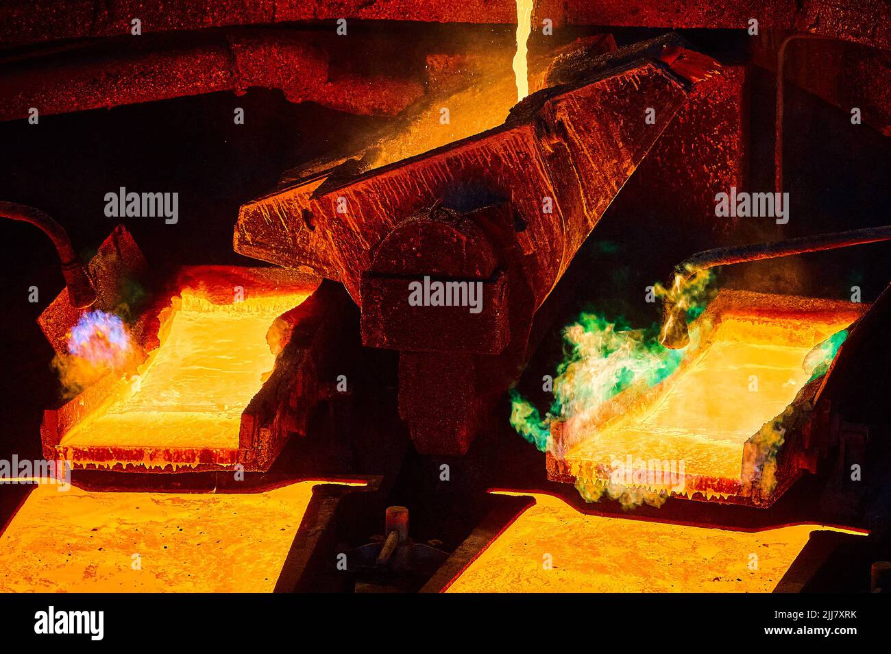 Pouring molten copper for anodes into form on casting wheel Stock Photo ...