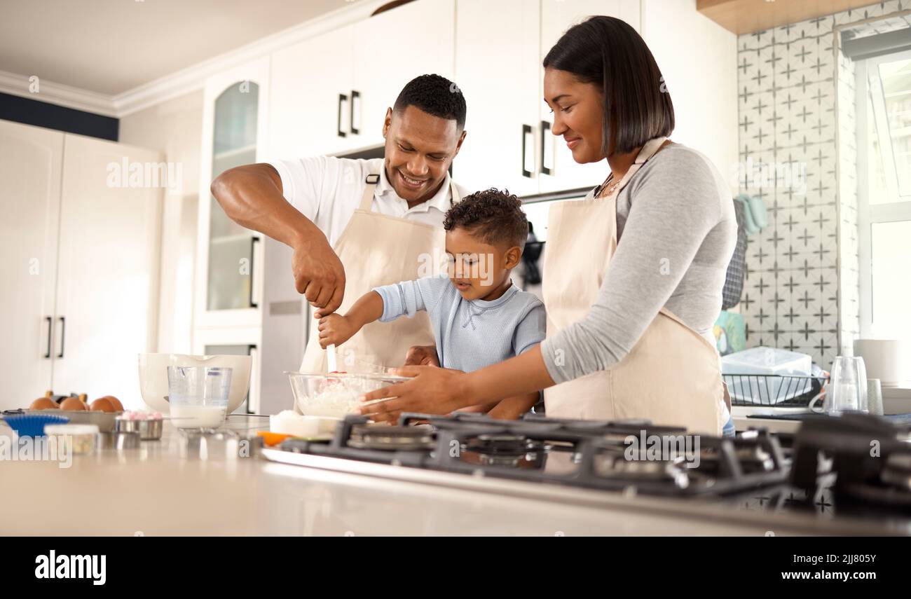 Shell have her own bakery. an adorable little boy baking with his