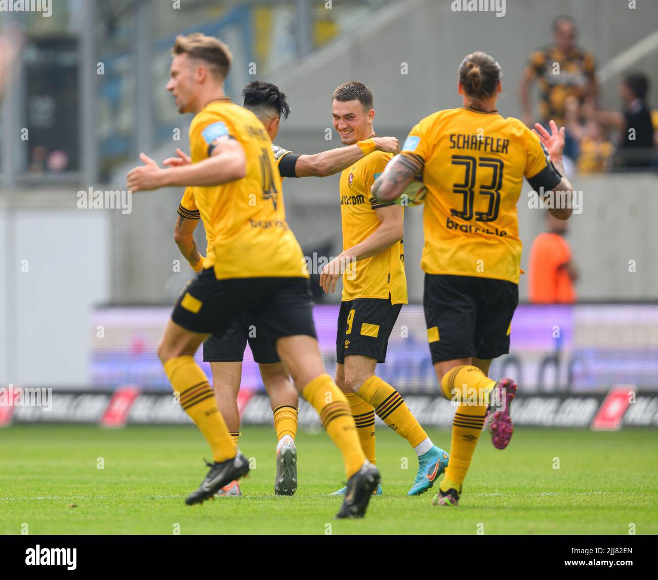 Dresden, Germany. 23rd July, 2022. Soccer: 3rd league, SG Dynamo Dresden - TSV  1860 Munich, Matchday 1, Rudolf Harbig Stadium. Dynamo's Kevin Ehlers  (l-r), Tim Knipping and Dennis Borkowski emotional. Credit: Robert