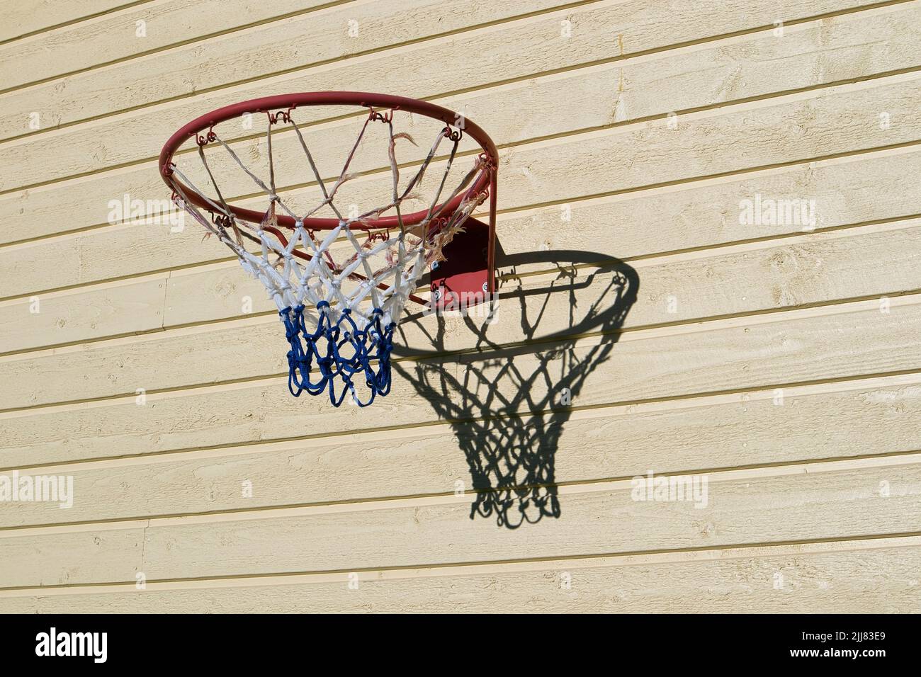 basketball hoop on wooden building wall Stock Photo Alamy