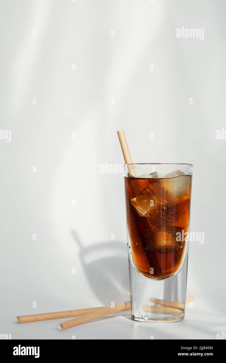 Glass of cola with ice and straw on a white background Stock Photo - Alamy