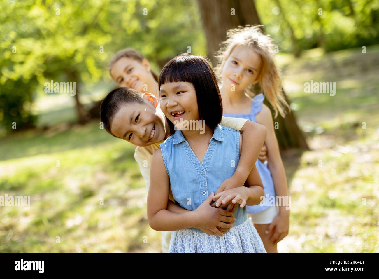 Group of cute asian and caucasian kids having fun in the park Stock ...
