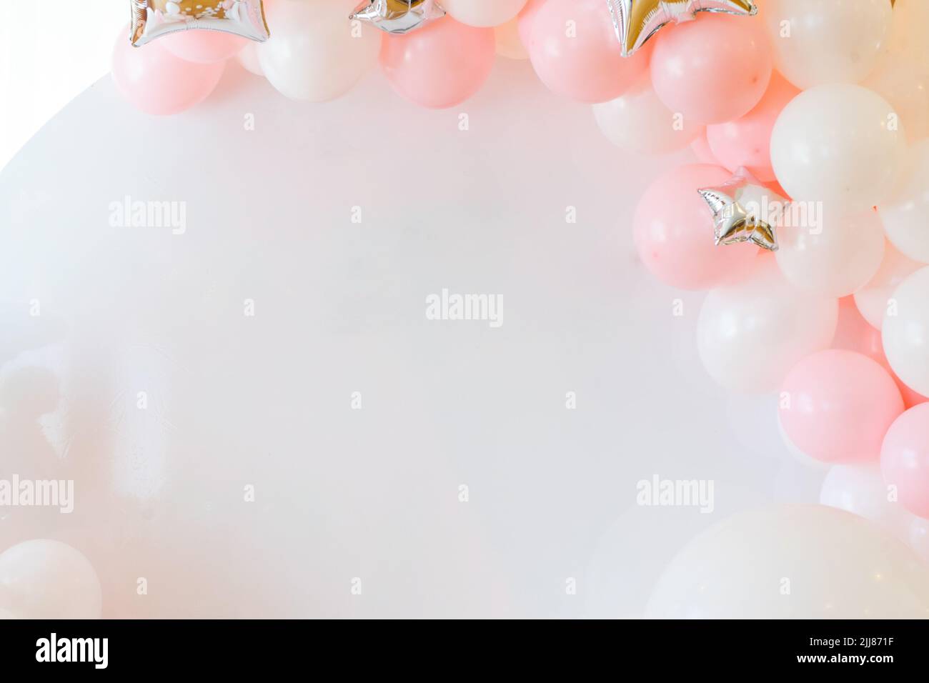 Birthday decorations with pastel balloons on white background Stock Photo -  Alamy