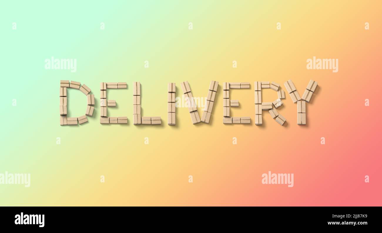 Word DELIVERY from cardboard boxes on color background. Stock Photo