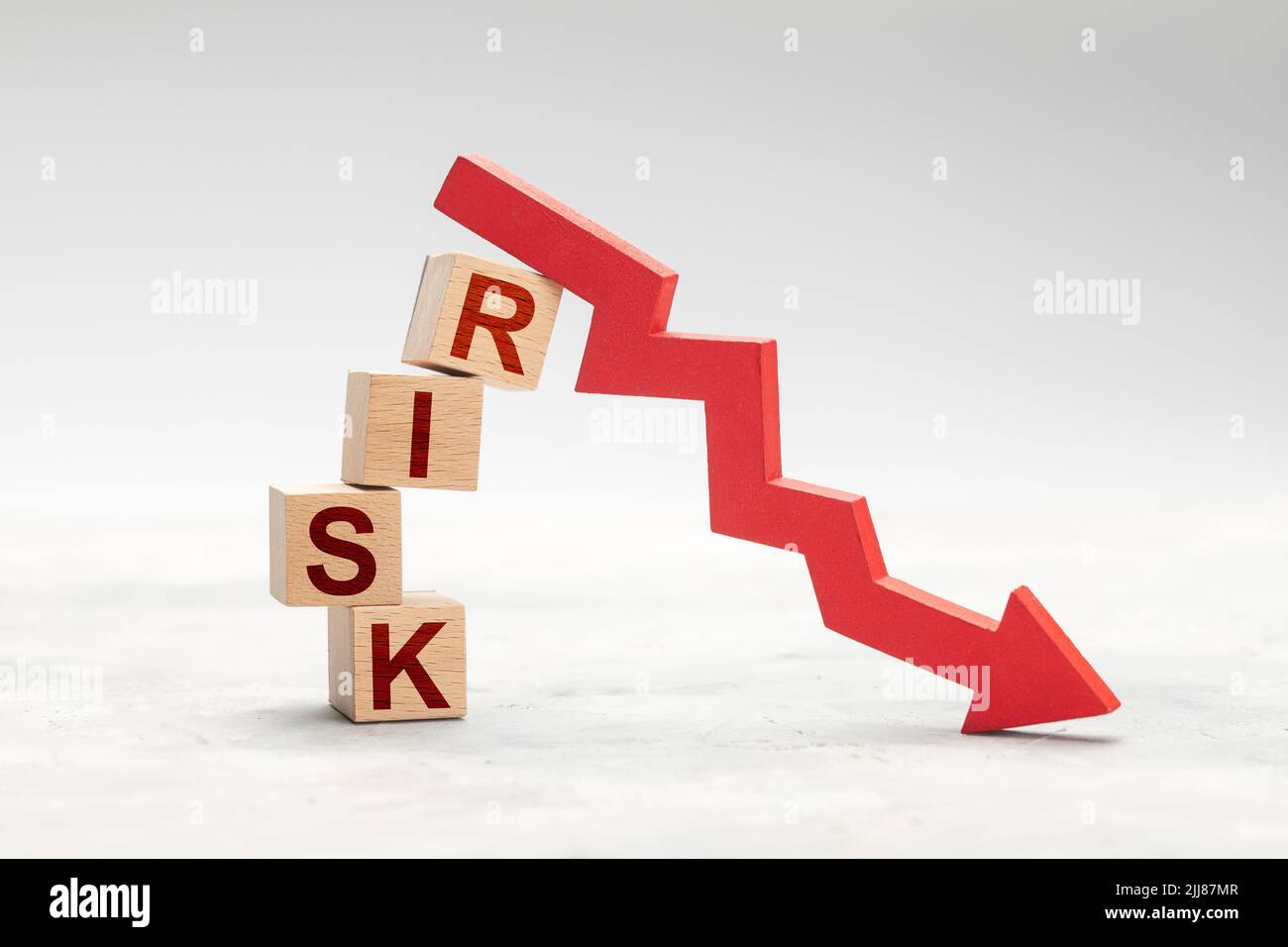 Fall risk. Red down arrow as a symbol of crisis or risky investment ...
