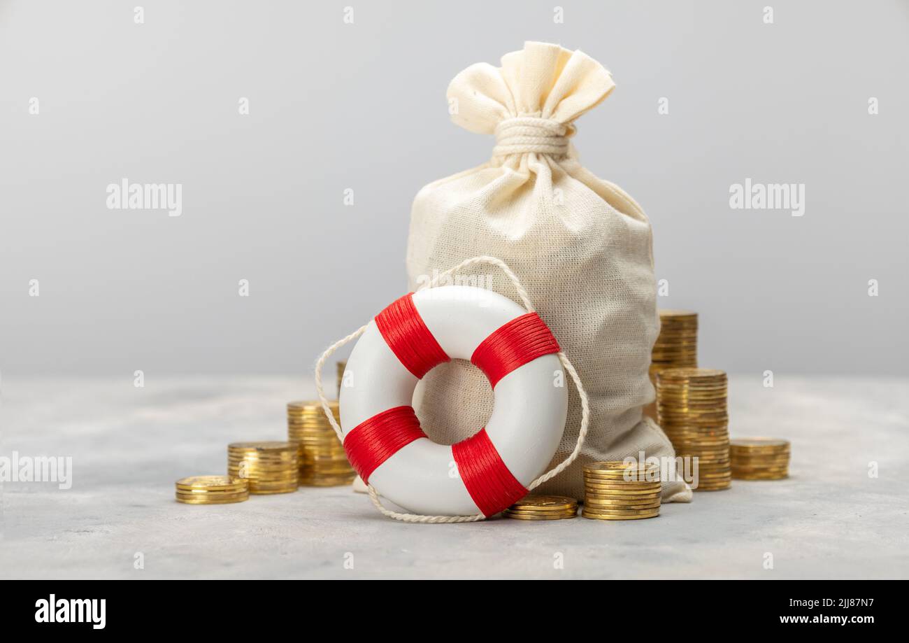 Help with finances. Assistance in investing. Money bag and lifeline. Stock Photo