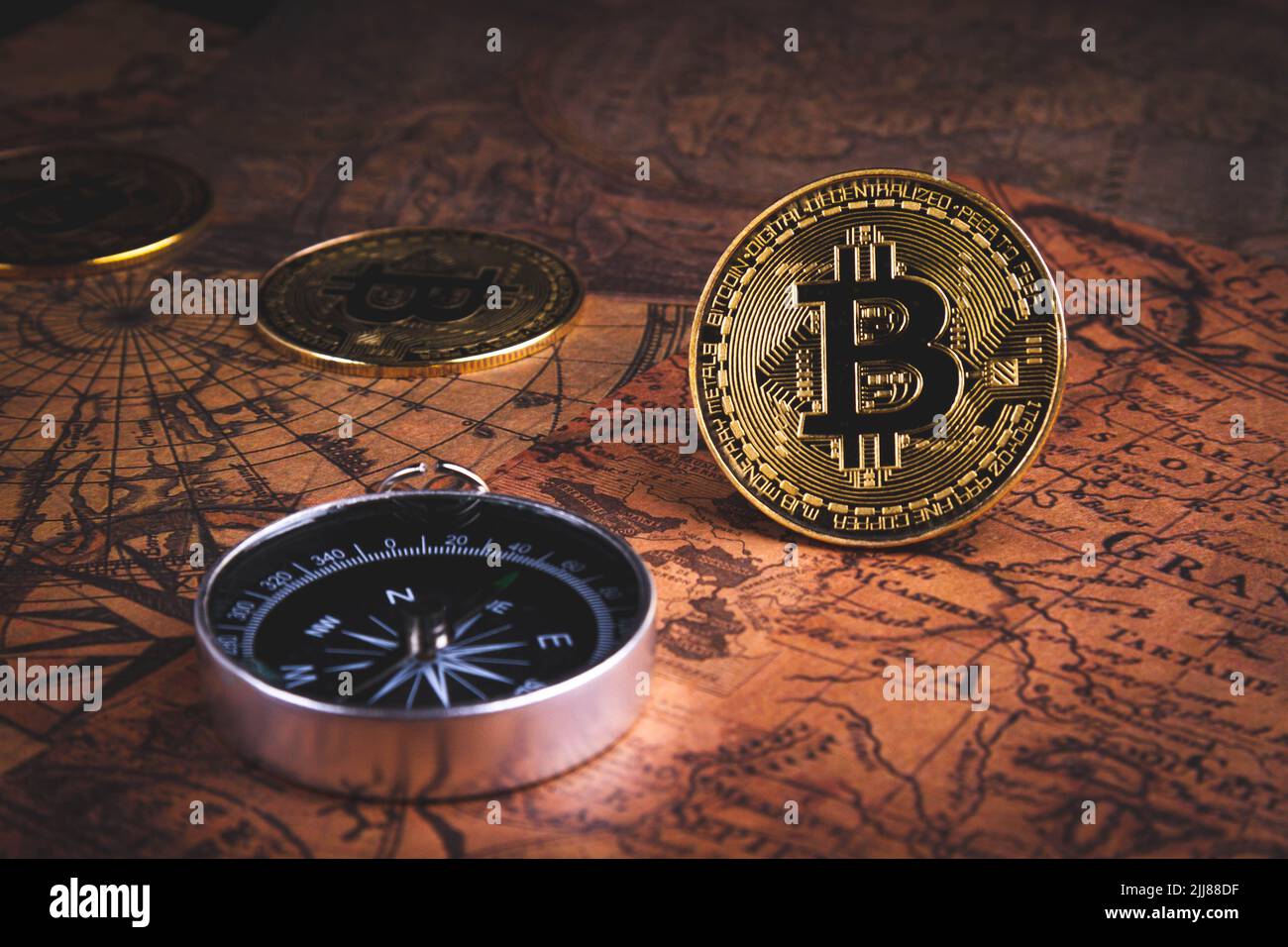 Compass and bitcoin. Travel and cryptocurrencies. Buying tickets with  bitcoins. Alternative currency and travel. Coin and compass on the map  Stock Photo - Alamy