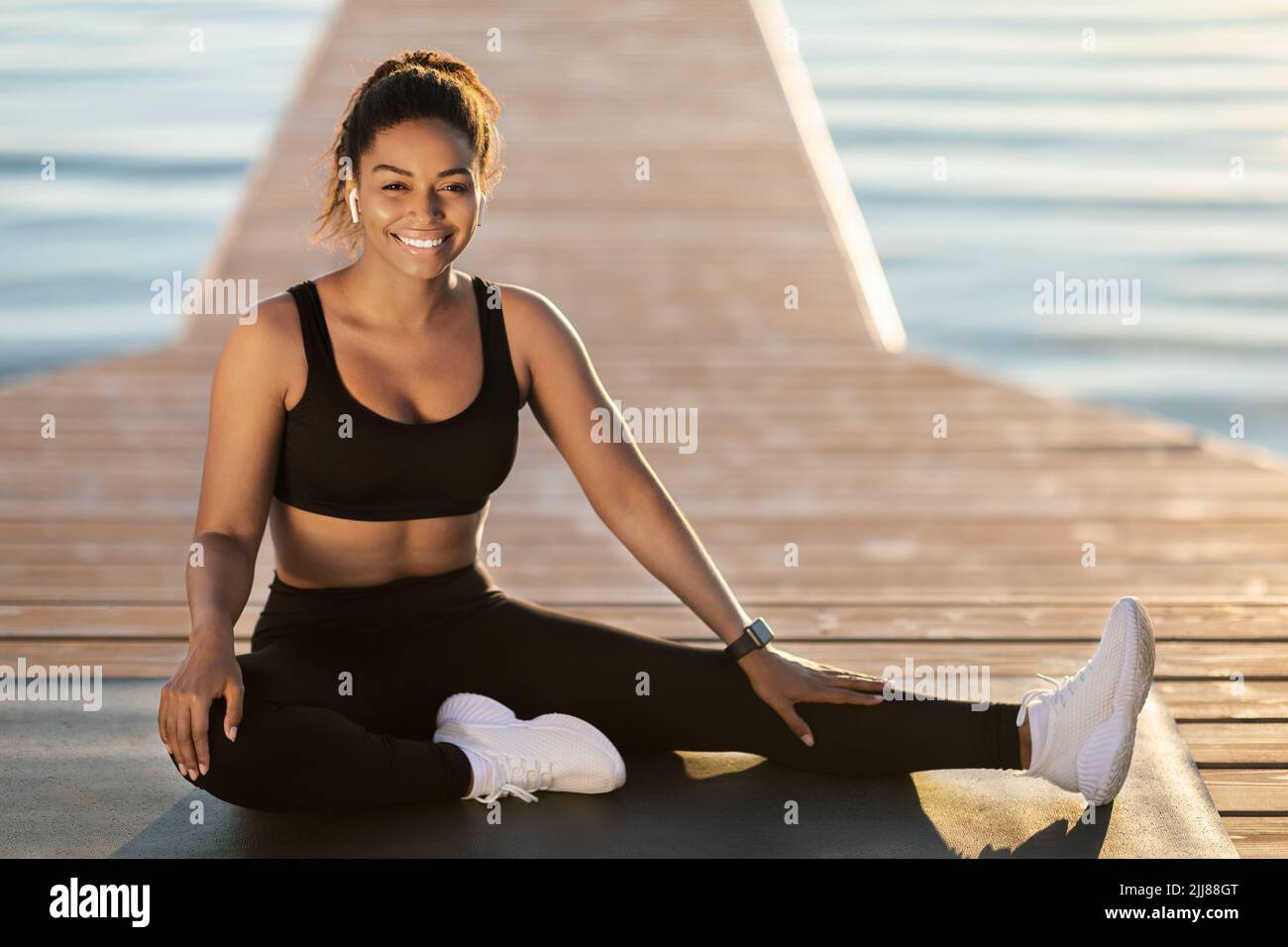 Happy While Exercise Happy pretty black woman posing while exercising outdoor Stock Photo ...