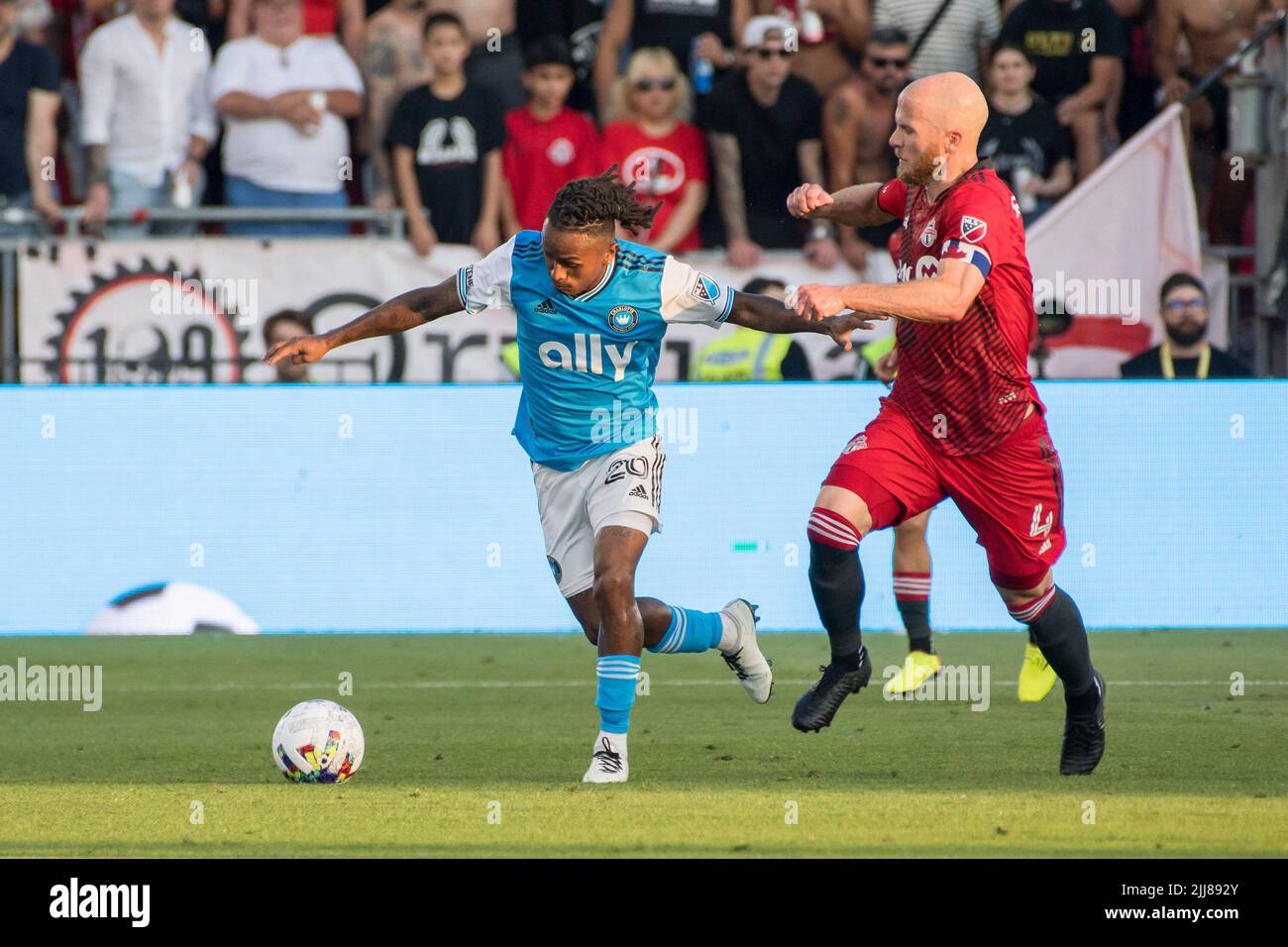 Yordy Reyna (26) and Michael Bradley (4) in action during the MLS game between Toronto FC and Charlotte FC at BMO field in Toronto. The game ended 4-0 for Toronto FC. (Photo by Angel Marchini / SOPA Images/Sipa USA) Stock Photo