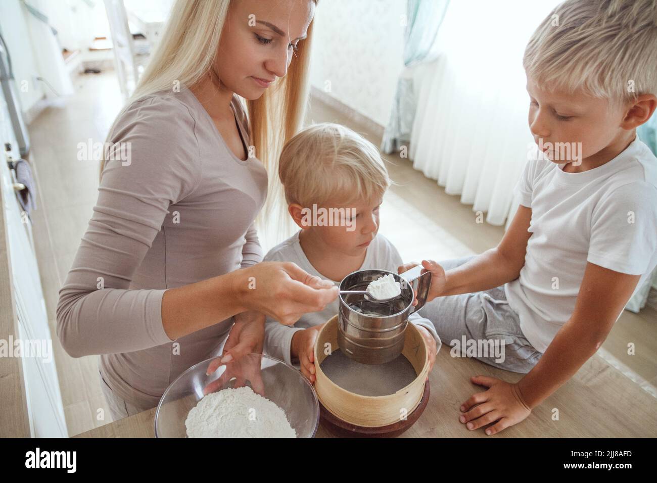 Mom cooking for boy hi-res stock photography and images - Alamy