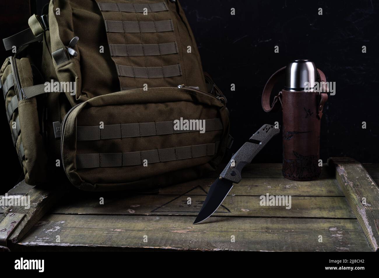 Army knife with black blade and olive handle. Green knife for the