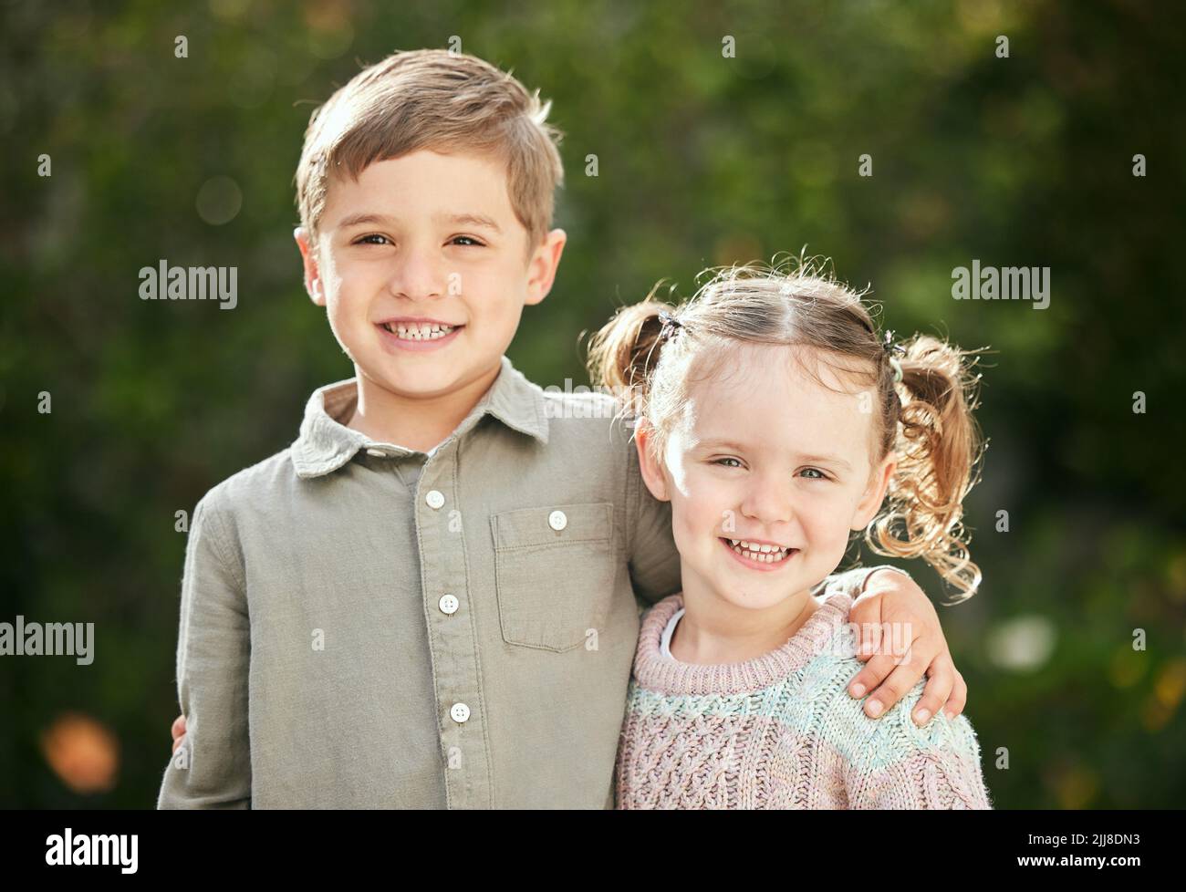 Hes my big brother. an adorable little boy and girl standing outside. Stock Photo
