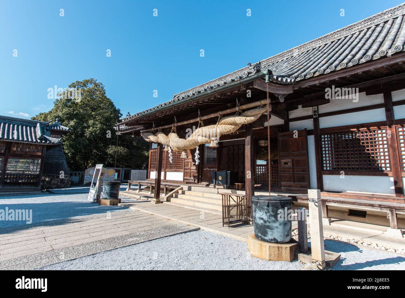 Kurashiki, Okayama, JAPAN - Dec 2 2021 : The Haiden (hall of worship) of Achi Jinja (or Achi Shrine) in sunny day. Stock Photo