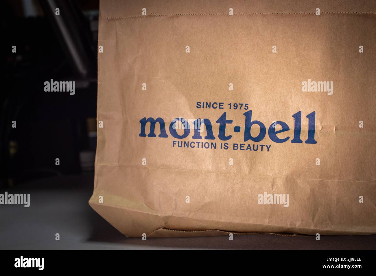 Closeup logo of Montbell (Mont-bell), Japanese outdoor clothing and equipment manufacturer and retailer, printed on a paper shopping bag. Stock Photo