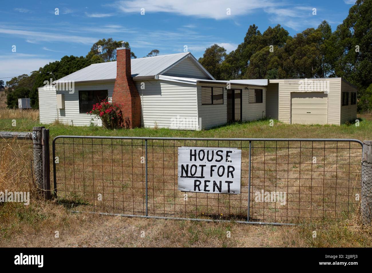 House not for rent sign symbolising of the rental accommodation housing crisis in Australia on a house in the agricultural north of Tasmania Stock Photo